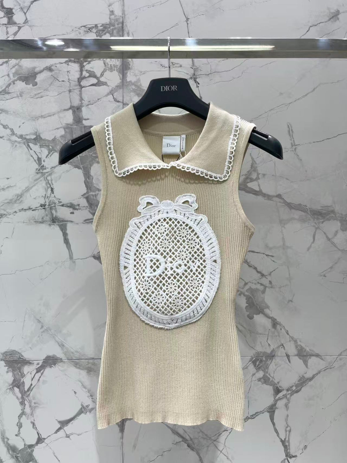 Open-knit vest with a Peter Pan collar