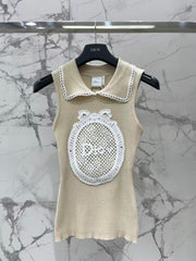 Open-knit vest with a Peter Pan collar
