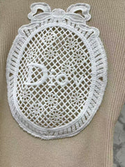 Open-knit vest with a Peter Pan collar