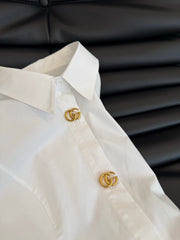 Waist-cinching shirt with large gold button accents