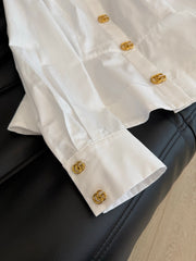 Waist-cinching shirt with large gold button accents