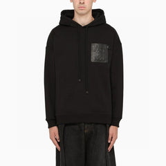 Hooded sweatshirt with embossed leather patch on chest